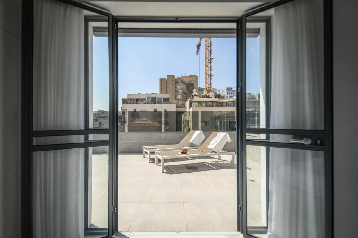 Image 1 of Bright & Modern 2BR Apt with Spacious Terrace 5-min from Beach by Sea N’ Rent