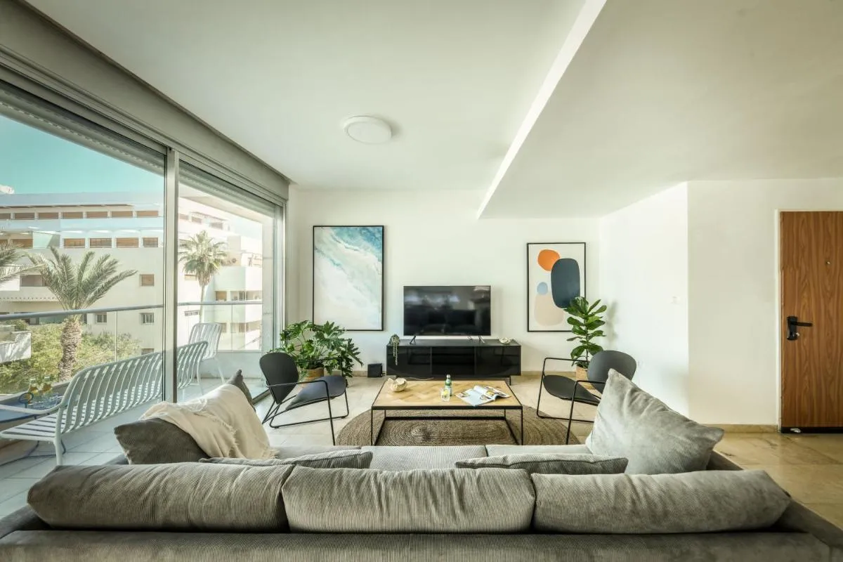 Image 1 of Chic Apartment w Balcony, Mamad & Parking 3-min from Beach by Sea N’ Rent