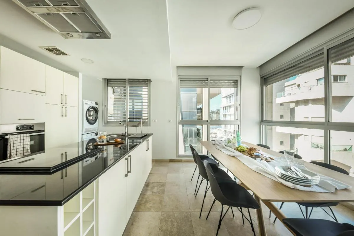 Image 4 of Chic Apartment w Balcony, Mamad & Parking 3-min from Beach by Sea N’ Rent