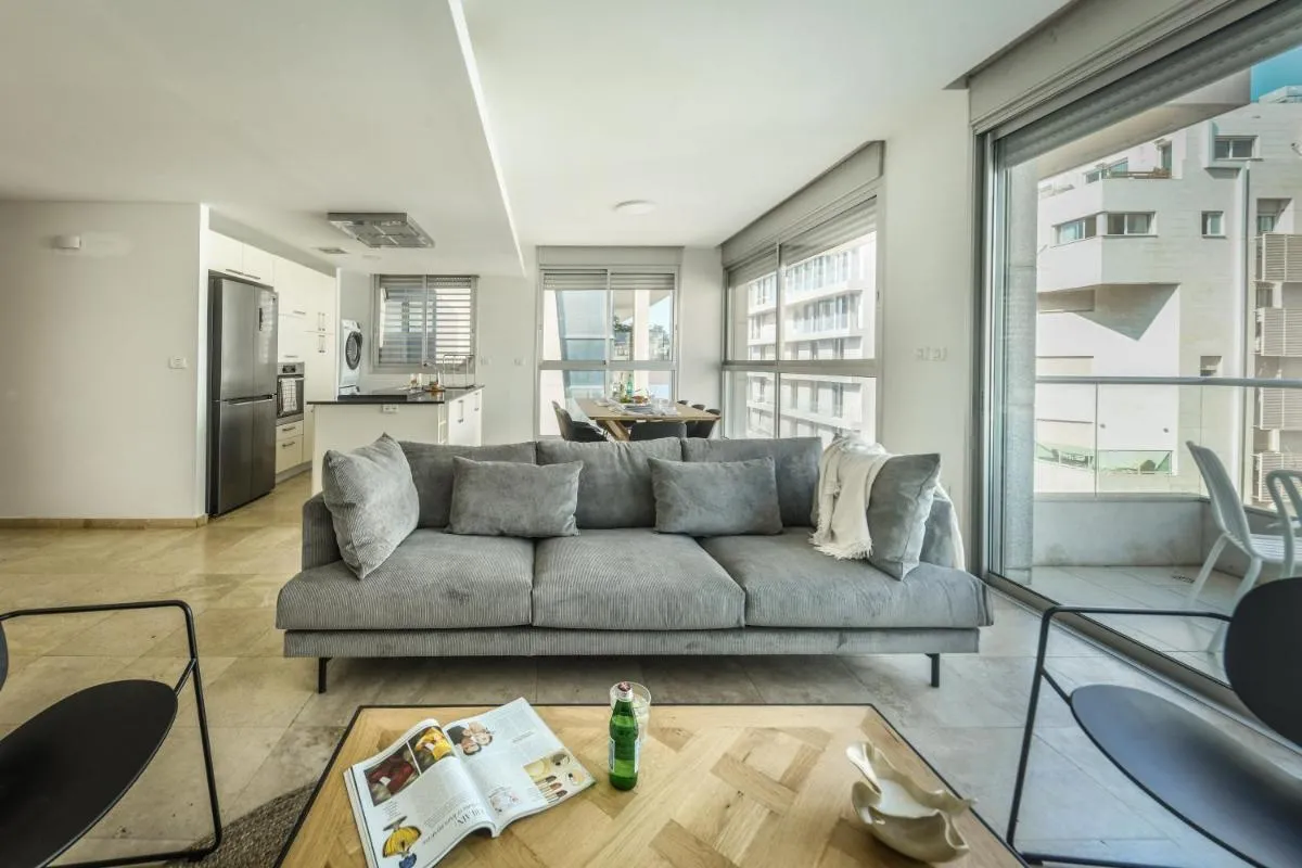 Image 5 of Chic Apartment w Balcony, Mamad & Parking 3-min from Beach by Sea N’ Rent