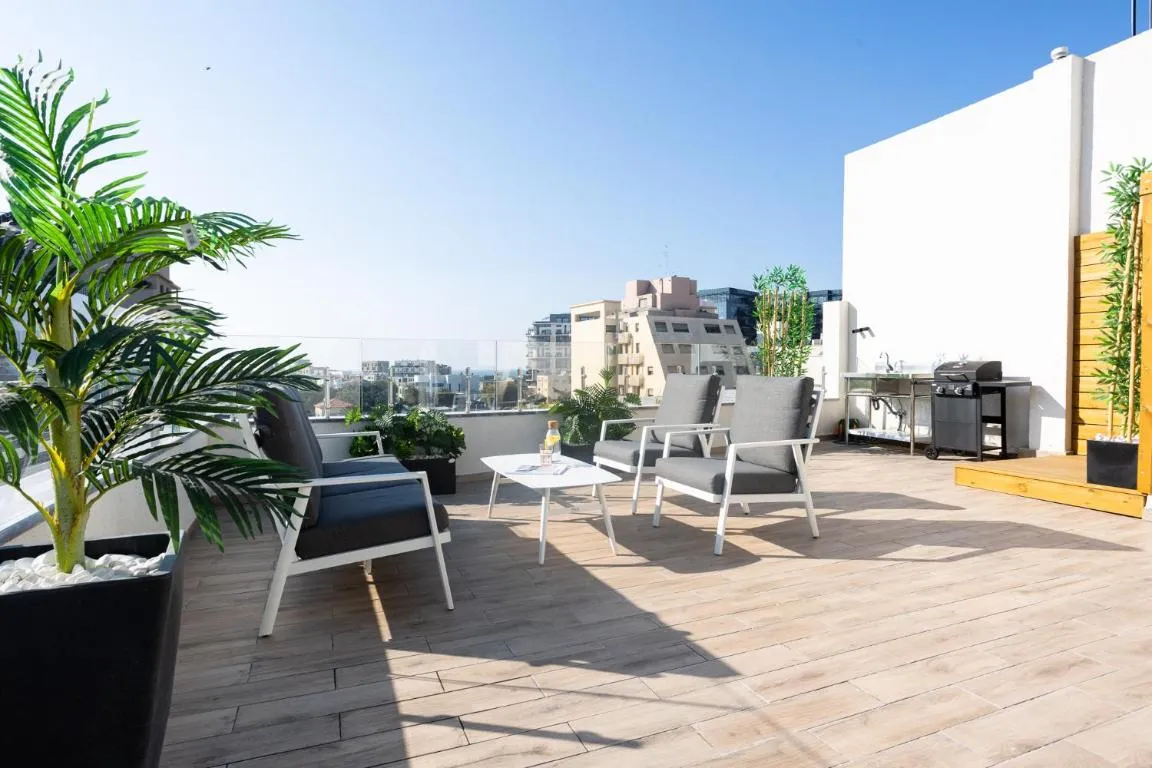 Image of YalaRent Flora- Designed 1BR penthouse in Florentin