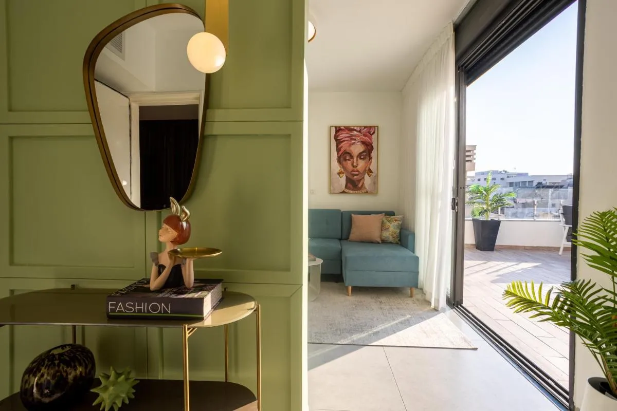Image 1 of YalaRent Flora- Designed 1BR penthouse in Florentin