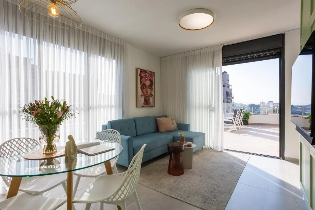 Image 5 of YalaRent Flora- Designed 1BR penthouse in Florentin